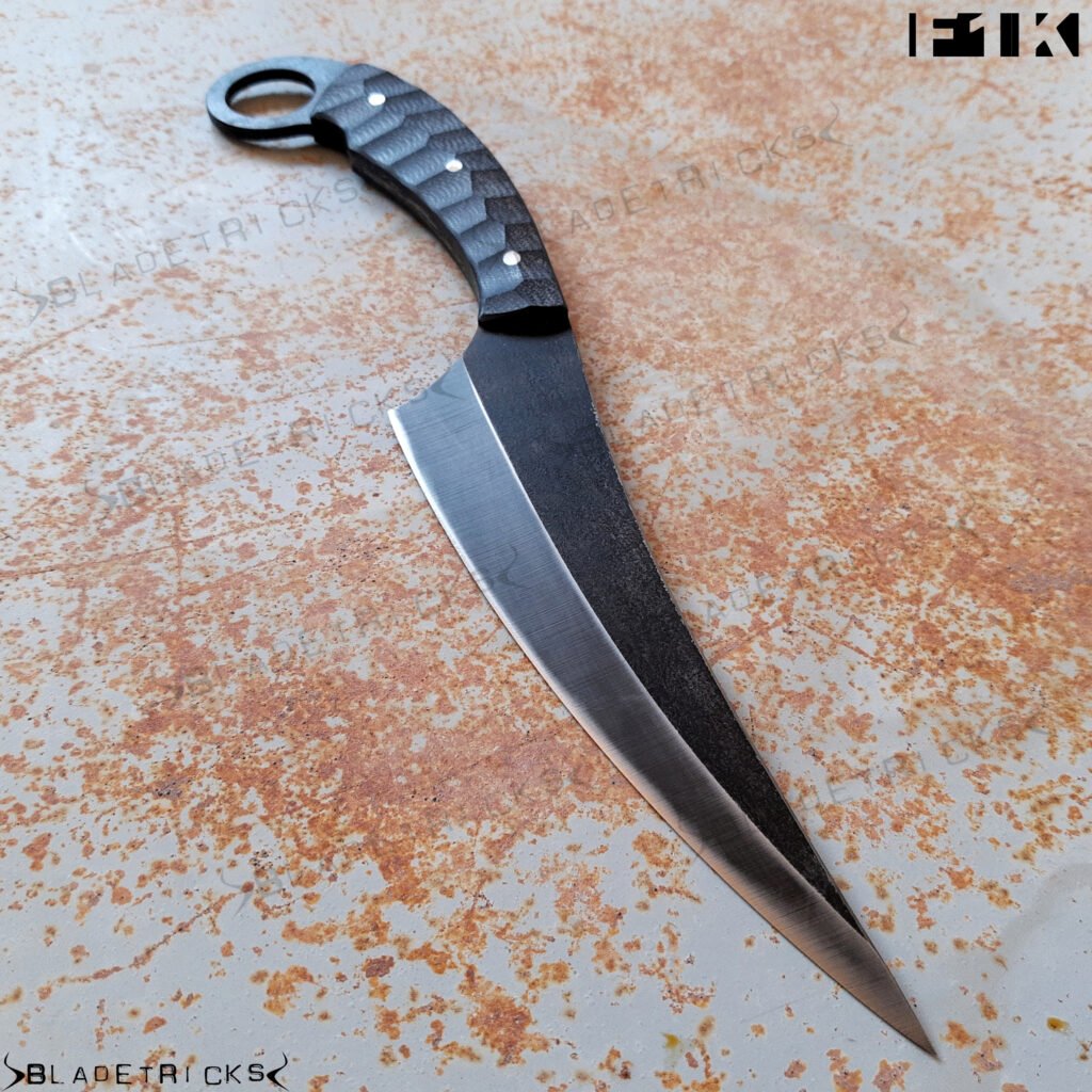 Bladetricks F1K black G10 karambit with faceted scales and progressive ground blade